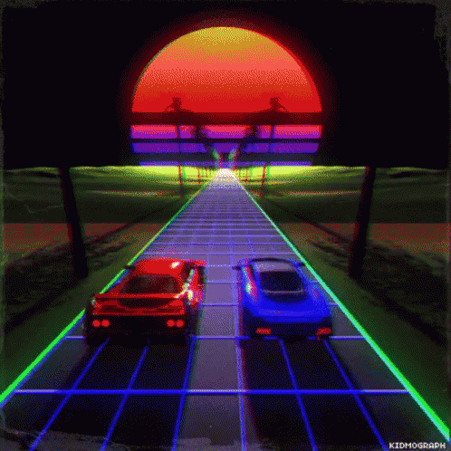 two cars driving in an illuminated street area