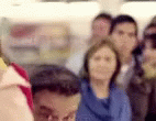 a blurry po of people holding some food