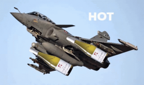 a jet fighter plane flies through the air