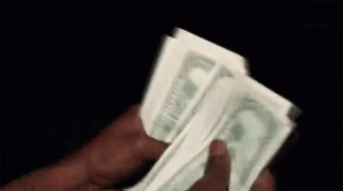 this is a hand holding four dollar bills