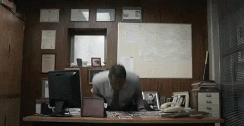 man sitting in an office space with a desk