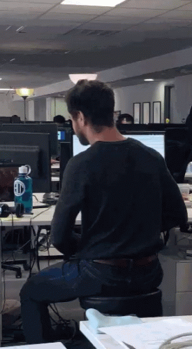 some guys in their office on computers