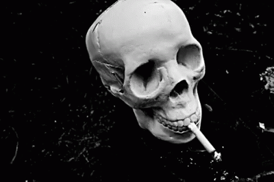 a person in black and white with a white cigarette