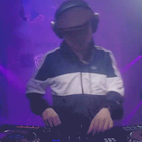 a dj in the process of mixing up music