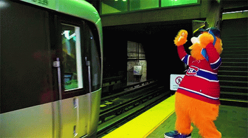 a person wearing an animal suit near a train