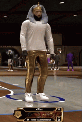 a virtual man wearing a blue suit in an indoor basketball game