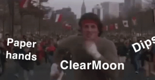 people on the street holding papers that say clear moon