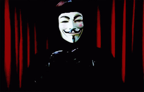 guy fawkett mask with face paint is over black curtain
