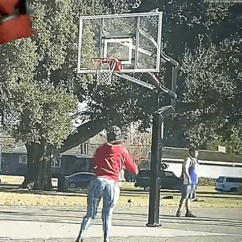 some men in the park playing basketball