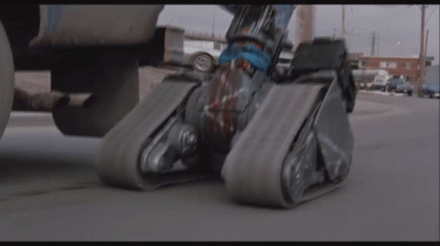 two roller blades on the pavement near a jet
