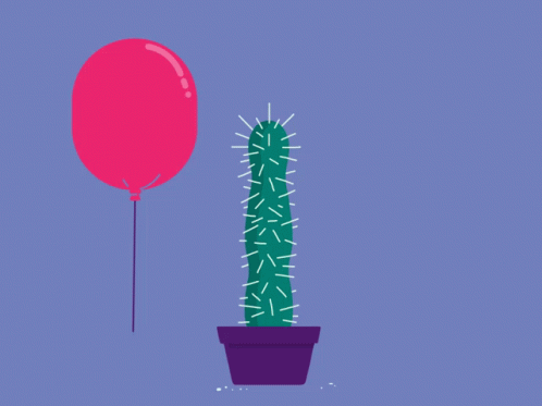 a purple balloon being blown over by a small cactus