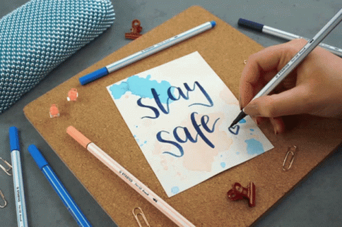 the words stay safe are placed next to some art supplies