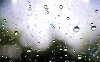 rain drops running down the glass as if they were in a storm