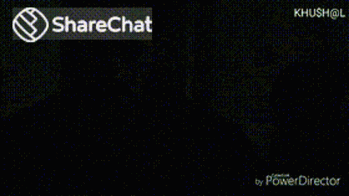 a blurry picture of a dark room with black walls and a sharechat sign