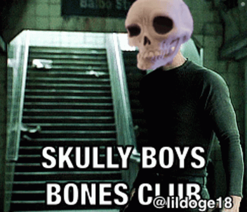 a skull wearing a costume next to a staircase