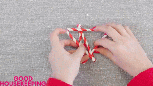 someone crocheting a rope with both hands