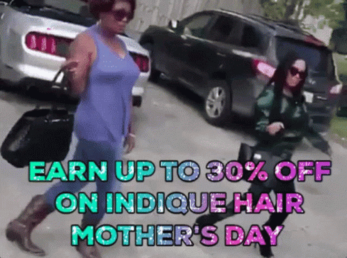 a woman is walking past another woman in front of cars with purple hair