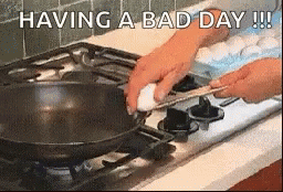 a person wearing blue gloves cooking soing on a stove