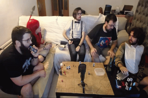 several friends are playing with video game controllers