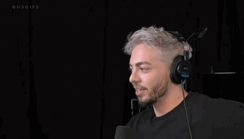 a man with grey hair wearing headphones