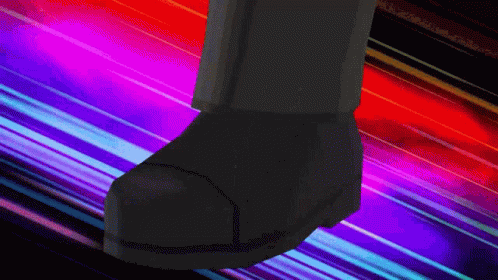 a pair of black shoes is shown on an abstract striped background