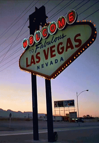 the neon las vegas sign in front of a power line