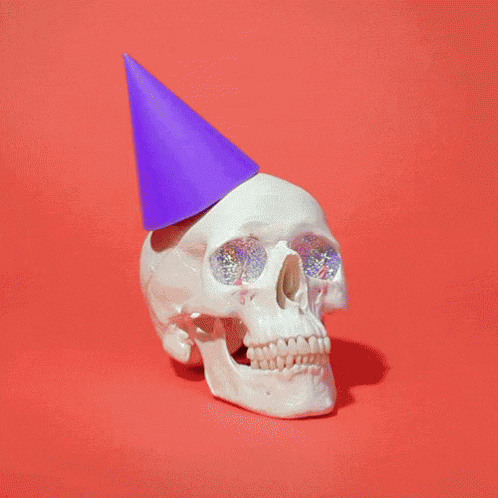 a white skull wearing a party hat