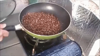 a pot full of water on top of a stove