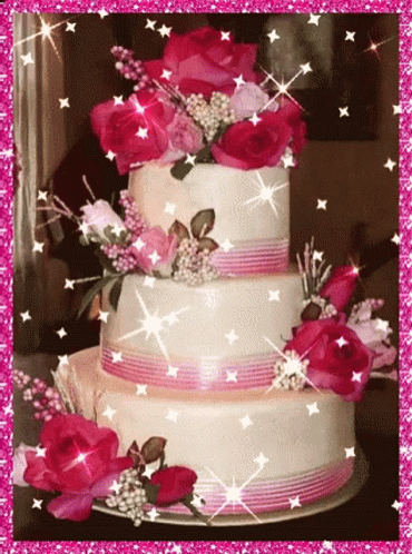 this is a wedding cake with purple flowers on top