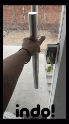 a person holding an outside door handle with the words bdbn above