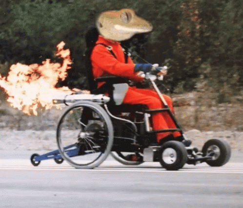 a woman in a wheel chair with a hat on