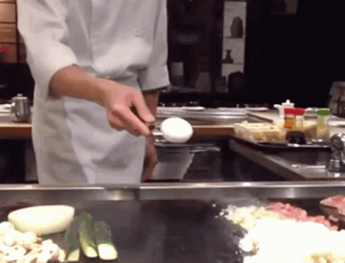 the chef uses a cloth to cover an egg in preparation