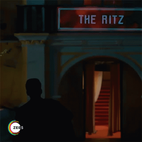 there is a blue exit sign with the name ritz