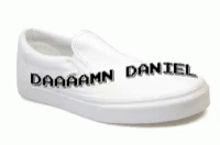 white and black slippers with danan daniel written on them
