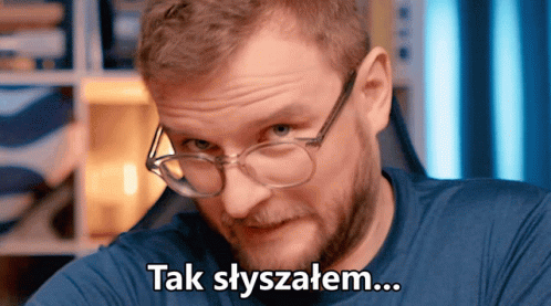 a man with glasses has an ad that reads take syzyzelm