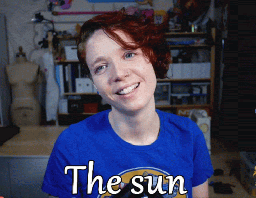 this image has the words the sun with blue hair