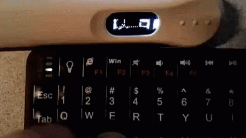 an old style typewriter that has been turned into a light blue clock