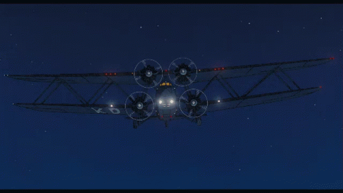 an old style plane flying through the sky at night