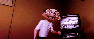 the puppet man is posing for a picture in front of an old tv