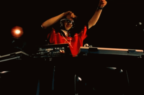 a dj mixing a music event in the dark