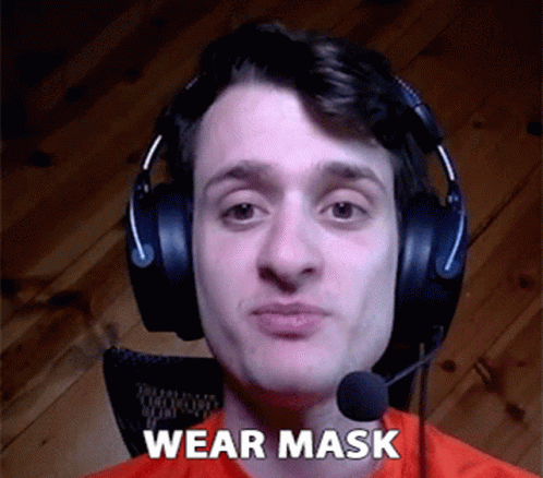 a man wearing head phones with the word wear mask