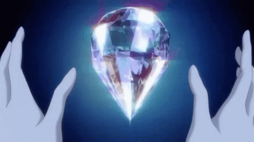 two hands holding a glowing diamond next to it