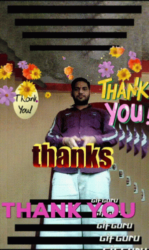 man in a black jacket, yellow pants, and blue flowers stands in front of a thank you card