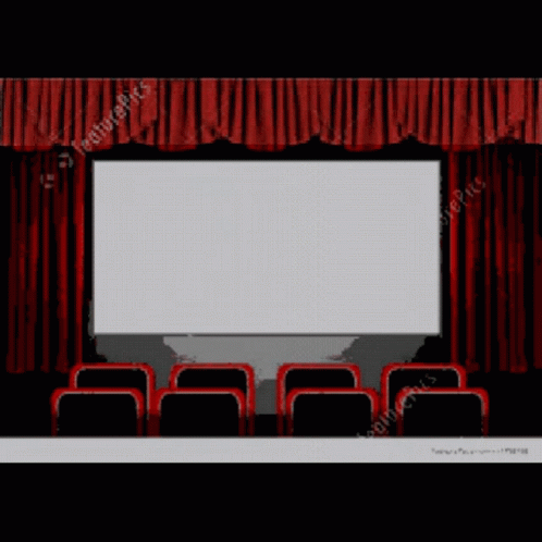 a blue theater auditorium with a large screen and chairs