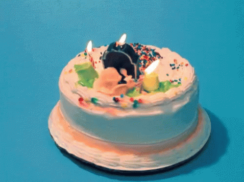 a birthday cake on a plate on a table