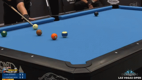 there are several mini balls sitting on the pool table