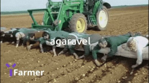 there are men working in the field with a tractor