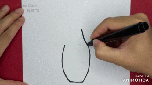a person drawing soing with a pen and paper