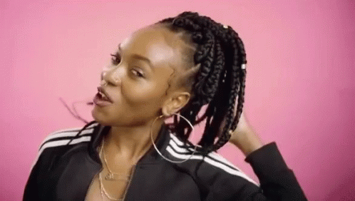 young black woman with cornrows making funny face