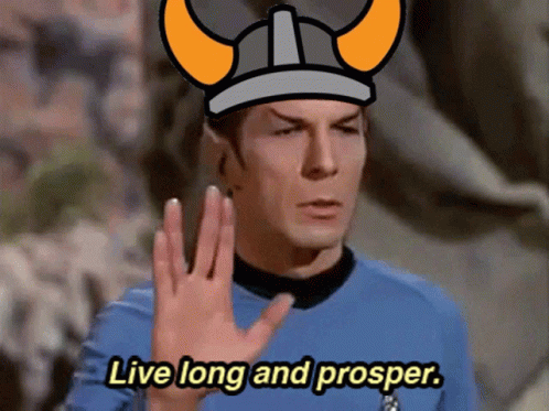 the star trek spock is pointing his hand to the sky